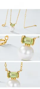 Detail view of gold-plated silver pendant with rectangle green stone and pearl