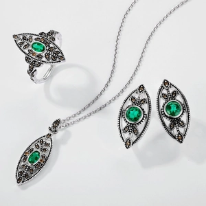 Vintage 925 sterling silver leaf jewelry set with lab-grown emerald and marcasite detail
