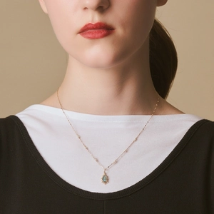 Close-up of S925 silver frame necklace with labradorite drop pendant on model neck