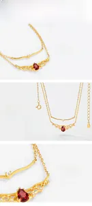 Macro detail of S925 silver gold-plated double layer necklace with red teardrop stone