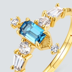 Detailed close-up of a vintage Art Deco ring with blue topaz and gold plated silver band