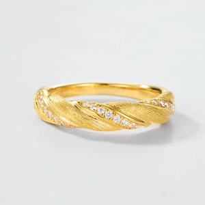 Golden Moebius twist ring with brushed texture and sparkling zircon inlay for women