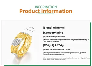 Macro detail of leaf-shaped silver ring with gold brushing and cubic zirconia stones