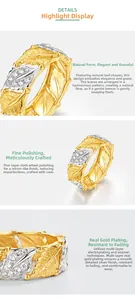 Macro detail of leaf-shaped ring with dual-tone plating and sparkling white gemstones