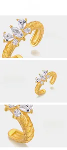 Detailed macro view of gold butterfly zircon ring with fine Italian brushed texture