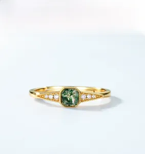 Detail of vintage S925 silver ring featuring square green moss agate and zircon accents