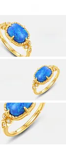 Detailed macro view of S925 silver gold-plated ring featuring blue opal and side diamonds
