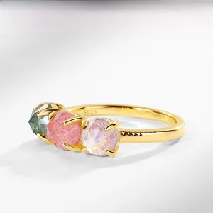 Detail of S925 sterling silver ring with three-stone green pink and purple gemstones