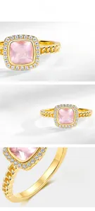 Macro detail of natural rose quartz ring with cubic zirconia halo and cuban chain band