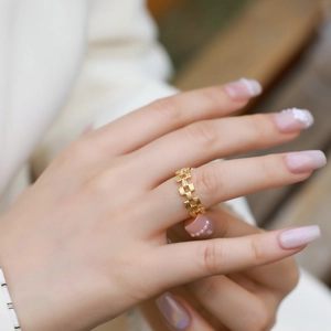 Adjustable gold cube ring with brushed woven texture and tiny cubic zirconia stones