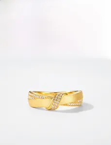 Close-up of S925 silver gold-plated ring with brushed metal and sparkling zircon detail