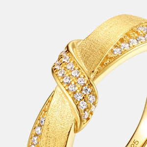 Detailed close-up of double-loop S925 silver gold-plated ring with frosted finish