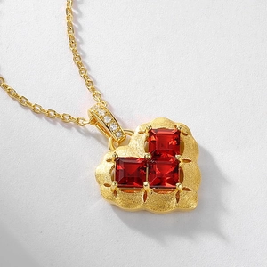 Brushed S925 silver heart necklace with garnet red stones and gold finish chain