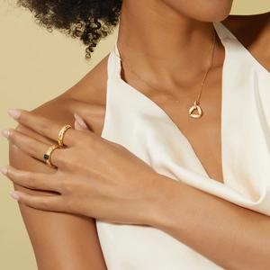 Elegant gold S925 sterling silver necklace and emerald ring jewelry set on model