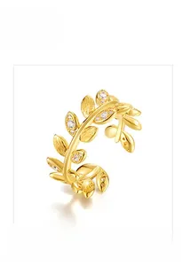Detail of S925 sterling silver golden leaf open ring with brushed finish and tiny zircons