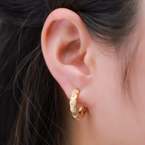 Vintage gold textured C-shape hoop earrings with crystal inlay and brushed metal finish
