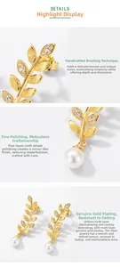 Detail showing handcrafted brushed texture on gold leaf earrings with S925 silver hallmark