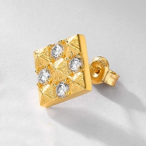Macro shot of 18K gold plated S925 silver square stud with pyramid texture and zircons