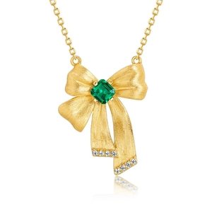 Luxurious S925 silver bow necklace featuring a radiant emerald gemstone with gold finish