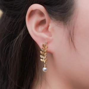 Elegant gold leaf drop earrings with sparkling zircon inlay and white round pearls
