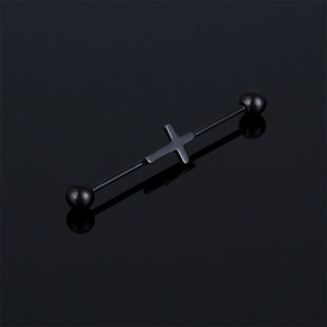 Detail view of a black stainless steel industrial barbell featuring a central cross charm