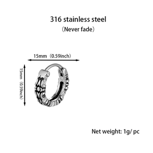 Detail of 15mm vintage engraved stainless steel hoop earring with floral pattern