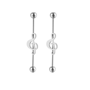 Macro detail of silver musical note industrial barbell earrings with polished steel finish