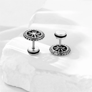 Detailed close-up of retro stainless steel stud earrings with star compass relief design