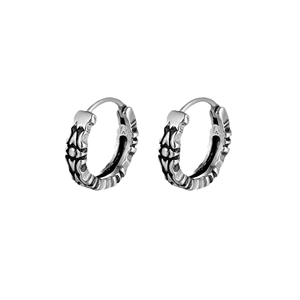 Vintage hollowed-out titanium steel hoop earrings with tribal embossed patterns in silver