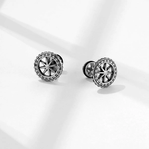 Industrial vintage stainless steel stud earrings with starburst pattern and aged finish
