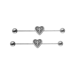 Detailed macro of stainless steel industrial barbells featuring heart and cross motifs