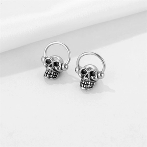 Punk style stainless steel skull earrings with retro silver finish and ring detail