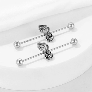 Vintage stainless steel industrial barbell earrings with butterfly and rose flower design