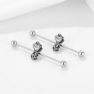 Vintage stainless steel industrial barbell set with floral rose and butterfly motifs
