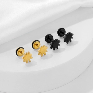 Star-shaped stainless steel stud earrings set in gold and black with matte finish