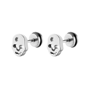 Close-up of stainless steel skull stud earrings with hollow eye sockets and punk style