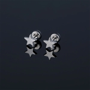 Minimalist silver star stud earrings with a polished metallic finish on a mirror base