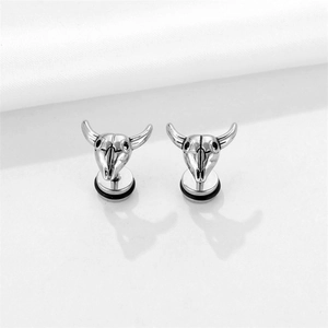 Pair of silver titanium bull skull stud earrings for men in punk rock style fashion