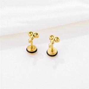 Gold stainless steel stud earrings with unique symbols and black rubber rings on white silk