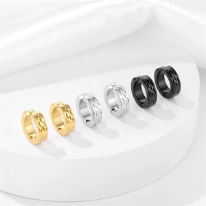 Three pairs of stainless steel huggie earrings in gold, silver, and black with fish scale patterns