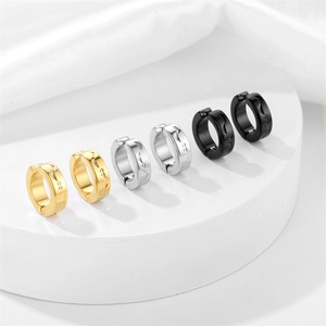 Polished stainless steel clip earrings set in gold silver and black with wavy patterns
