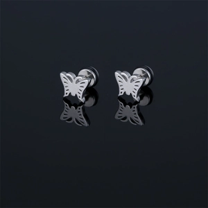 Polished stainless steel butterfly stud earrings with hollow design on black mirror surface