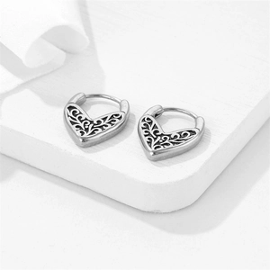 Vintage heart-shaped hollow earrings in retro silver stainless steel with vine patterns