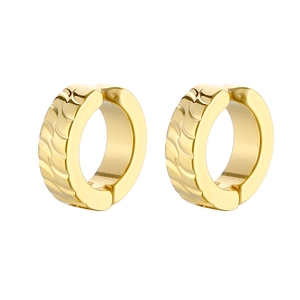 Detailed close-up of golden thick hoop earrings featuring unique spiral textured finish