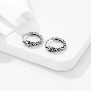 Minimalist stainless steel hoop earrings with snake skin texture and black gemstone eyes