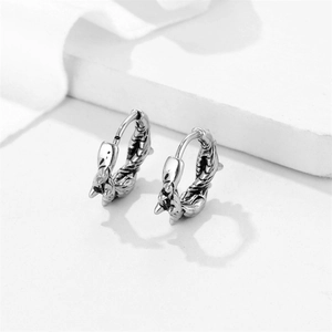 Punk style stainless steel hoop earrings with textured dragon scale patterns in silver