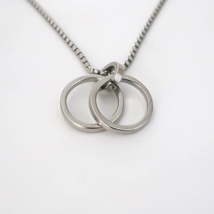 Minimalist stainless steel double interlocking ring pendant with a sleek silver box chain