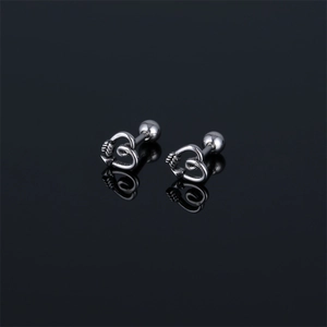 Polished stainless steel heart and arrow earrings with screw ball backs on black background