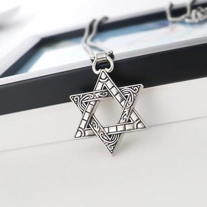 Retro hexagram star pendant necklace with relief scroll patterns and vintage silver finish