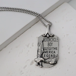 Macro shot of square eagle pendant with Motorcycle Boy and America Legend engraving